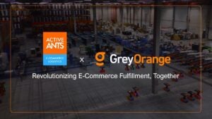 The Active Ants and GreyOrange logos together in front of a picture of the Active Ants floor with the words "Revolutionizing E-Commerce fulfillment, Together" written underneath.